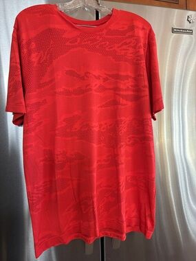 Lululemon Men's Orange Athletic Mesh T-Shirt textured fabric.